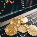 Investing in gold and investing in cryptocurrency can influence the market and each other. Here's how these separate investing fields can intertwine.