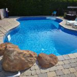 You don't need a million dollars to create a beautiful backyard pool and pool house for your home. Take a look at these pool house ideas on a budget.