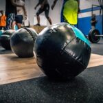 Are you trying to decide between completing CrossFit or HIIT workouts? Here is a guide to these two different types of workouts.