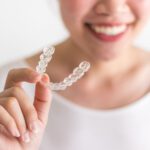 Keeping your Invisalign clean as a new user requires knowing what not to do. Here are Invisalign cleaning mistakes for beginners and how to avoid them.